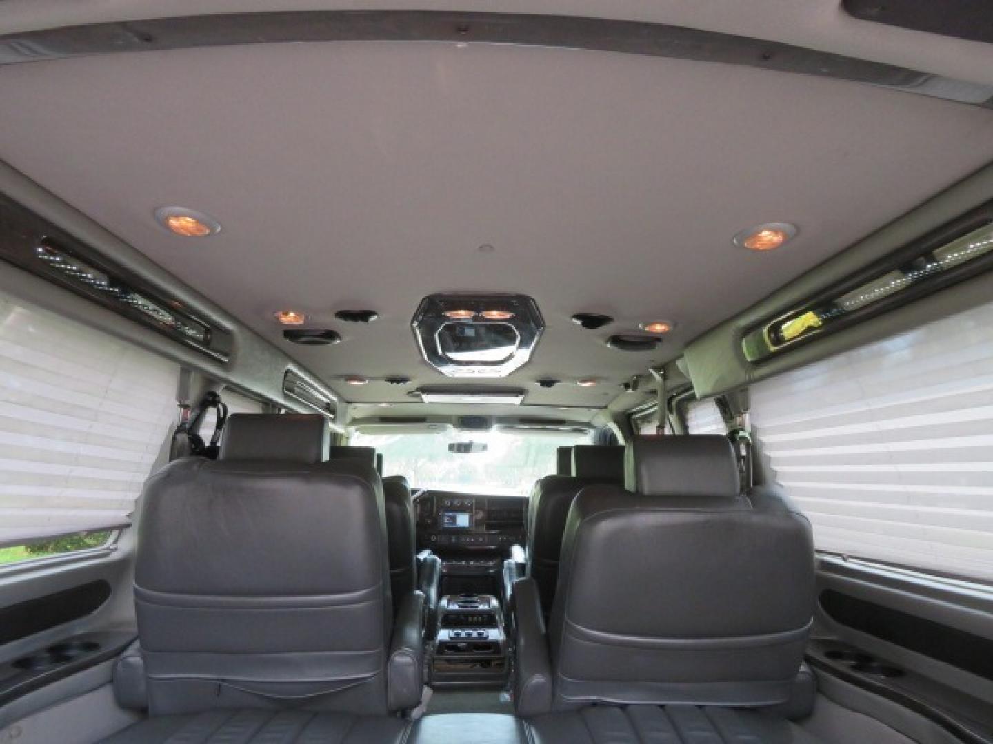 2014 Chevrolet Express (1GBWGLCG3E1) , located at 4301 Oak Circle #19, Boca Raton, FL, 33431, (954) 561-2499, 26.388861, -80.084038 - You are looking at a Rare 2014 Chevy Express 2500 Quigley 4x4 Four Wheel Drive Explorer Limited SE 9 Passenger Conversion Van with: 107K Original Miles, 6 Captain Chairs, Rear Power Folding Bench Seat Bed, Center Consoler Cooler, Front PPF (Paint Protection Film) Explorer Limited Conversion Througho - Photo#84